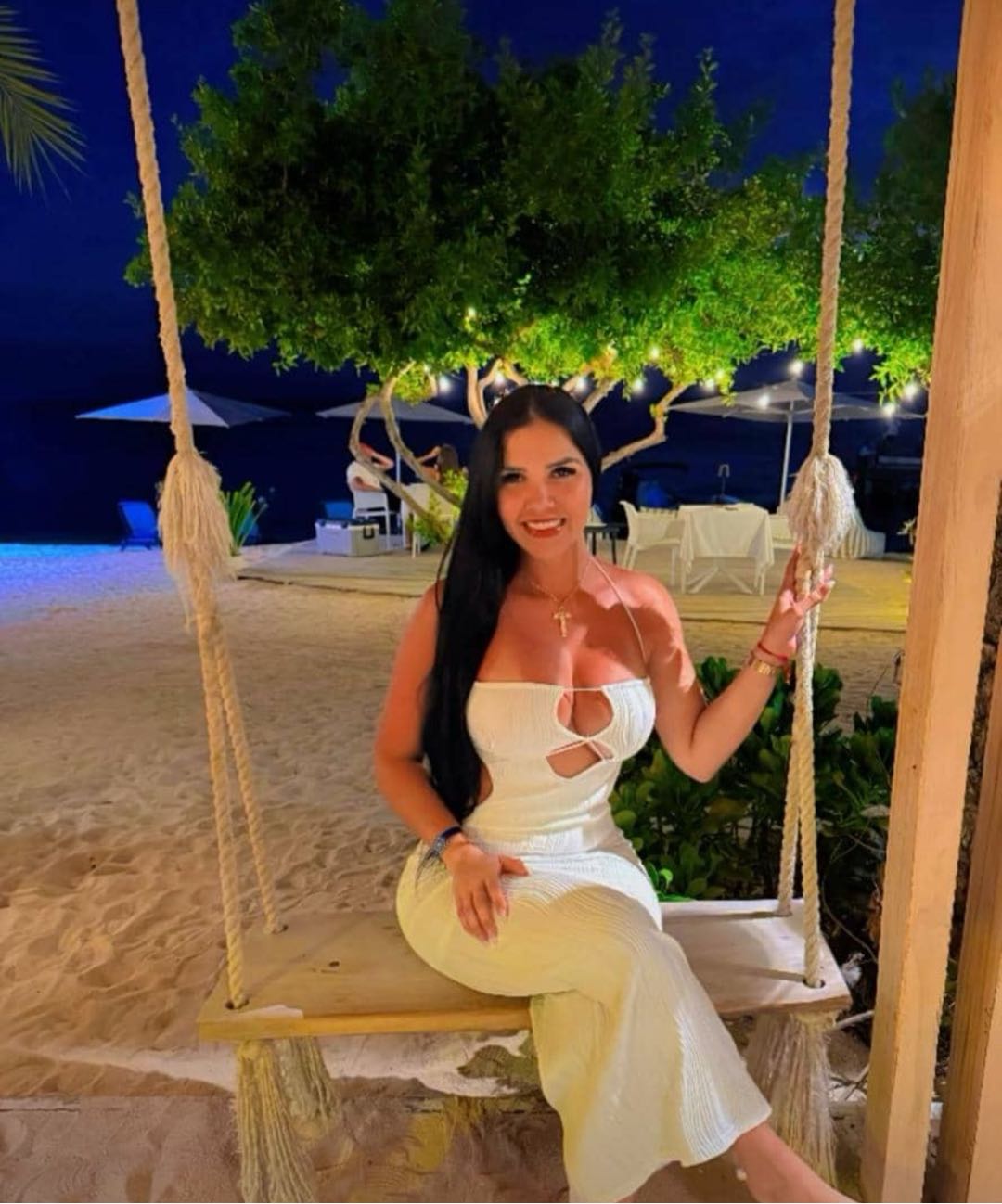 video chat with girls — Sabri on a beach swing at night