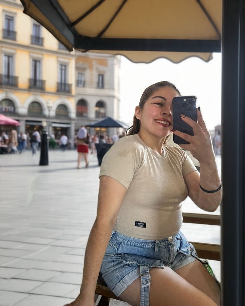 free video chat online — Nerea smiling at a sunny café