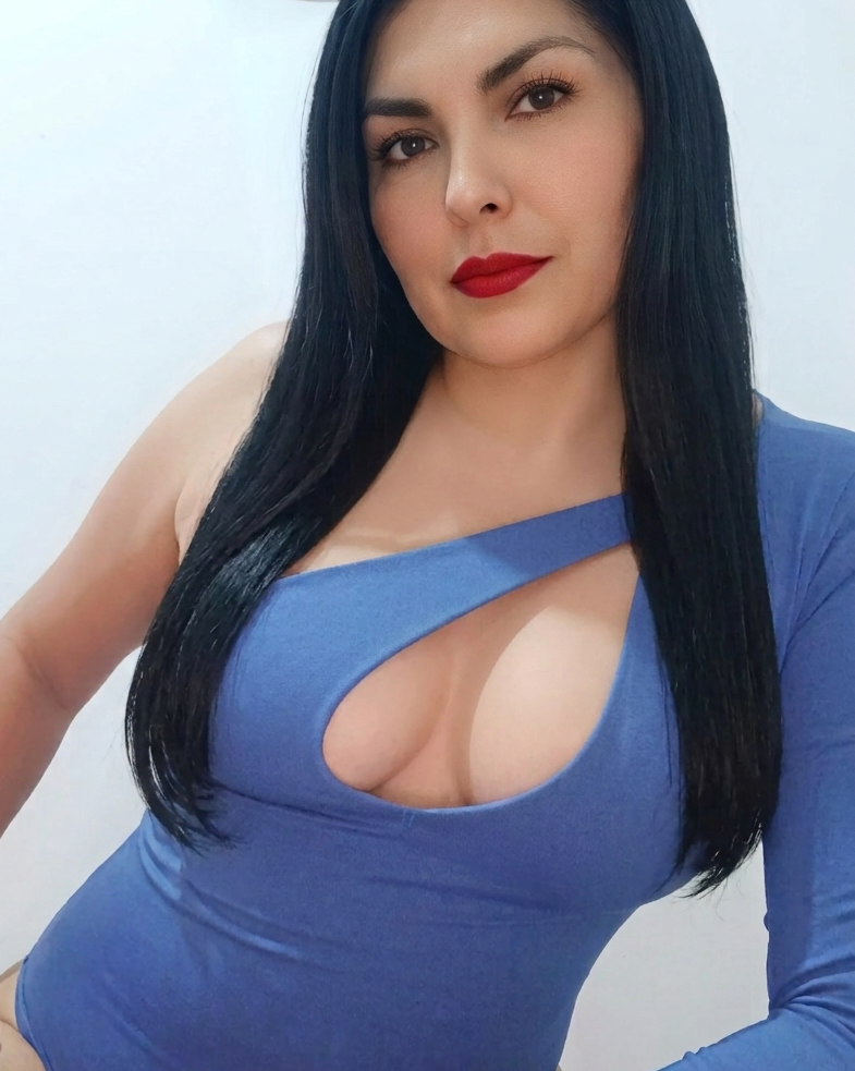 random cam chat done right — Ginna bright blue-dress portrait